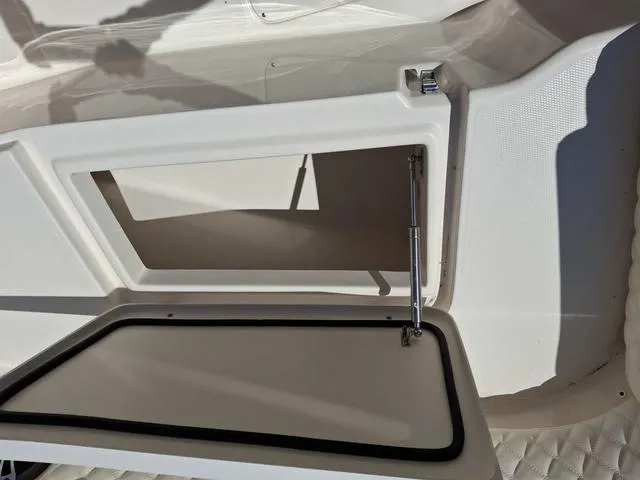 Slide: The Image of Open storage compartment on a 2025 Grady-White Freedom 307 boat. - 16