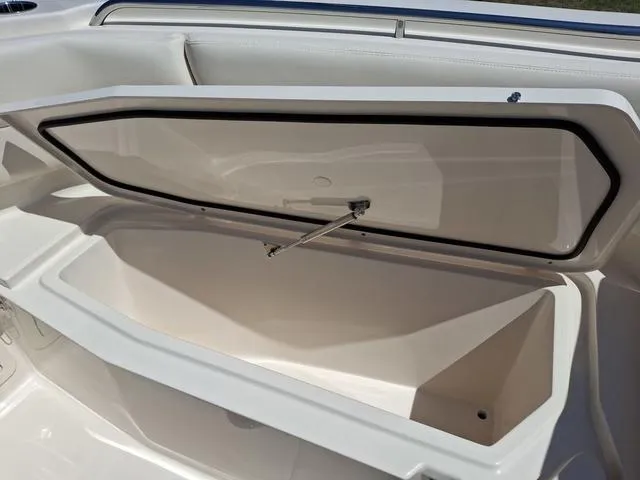 Slide: The Image of Open storage compartment on 2025 Grady-White Freedom 307 boat, showcasing spacious interior. - 17