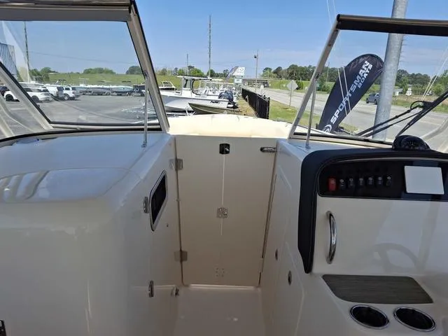 Slide: The Image of 2025 Grady-White Freedom 307 boat interior with dashboard and controls. - 20