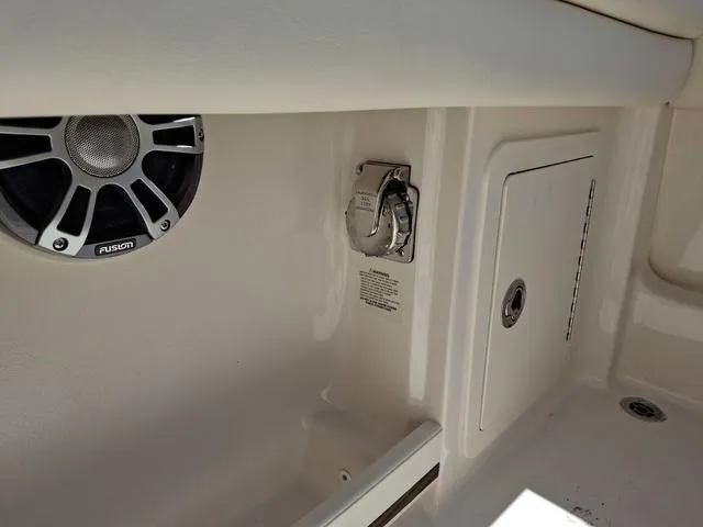 Slide: The Image of 2025 Grady-White Freedom 307 boat interior with speaker and storage compartment. - 26