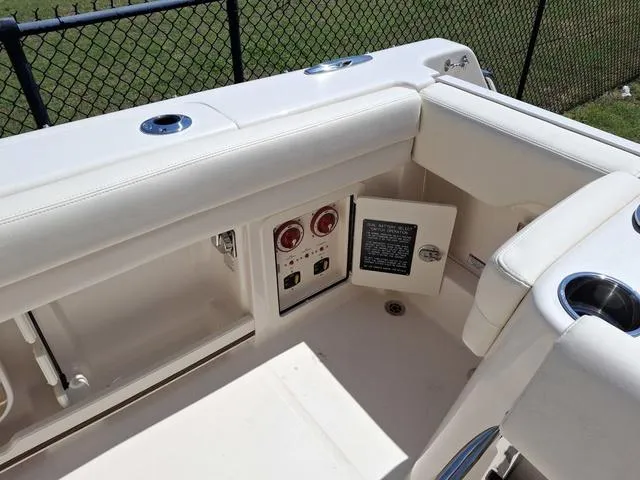 Slide: The Image of 2025 Grady-White Freedom 307 boat interior with control panel and seating area. - 27