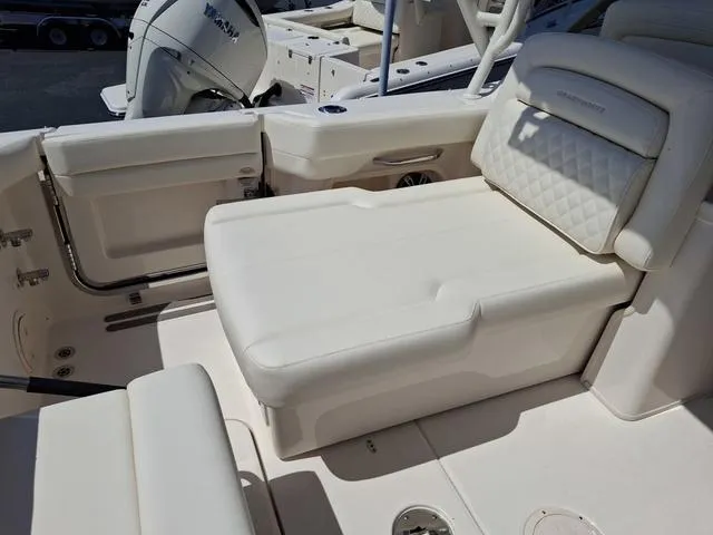 Slide: The Image of 2025 Grady-White Freedom 307 boat interior with luxurious seating and modern design. - 29
