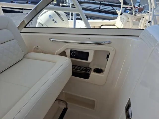 Slide: The Image of 2025 Grady-White Freedom 307 boat interior with seating and storage compartments. - 42