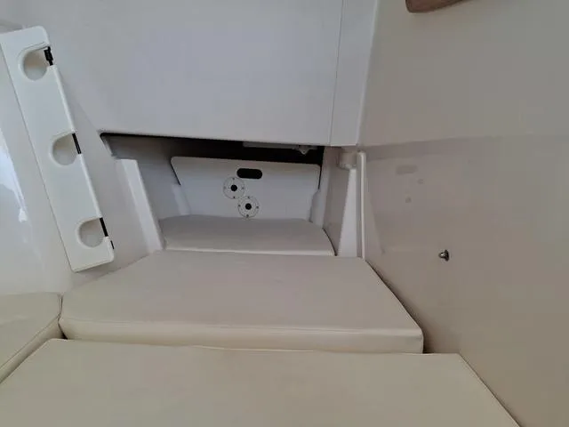 Slide: The Image of 2025 Grady-White Freedom 307 interior seating area with white cushions. - 46