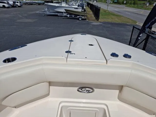 Slide: The Image of 2025 Grady-White Freedom 307 boat interior, showcasing bow seating and storage area. - 6