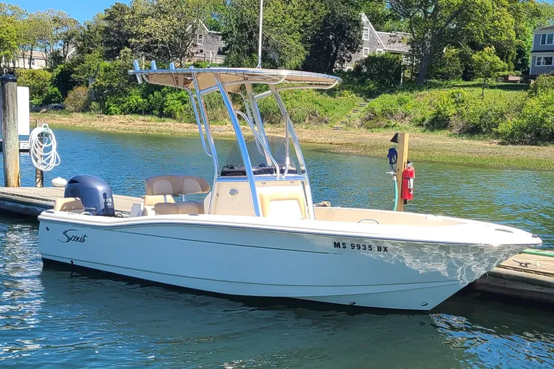 The Image of 2021 Scout 195 Sportfish boat docked on a sunny day, featuring sleek design and modern amenities. - 0