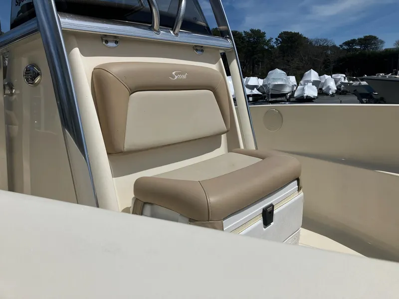 Slide: The Image of 2021 Scout 195 Sportfish boat interior with beige seating and console. - 5