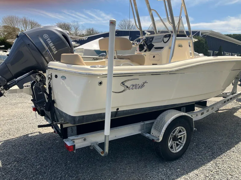 Slide: The Image of 2021 Scout 195 Sportfish boat on trailer with Yamaha outboard motor. - 6