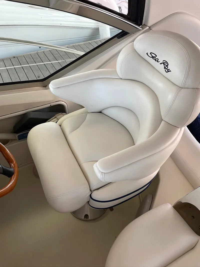 Slide: The Image of White captain's chair on 2004 Sea Ray 420 Sundancer yacht, featuring elegant design. - 12