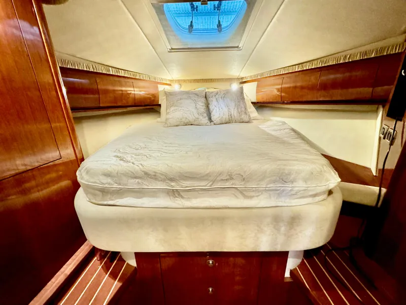 Slide: The Image of Luxurious cabin interior of 2004 Sea Ray 420 Sundancer yacht with cozy bed. - 19