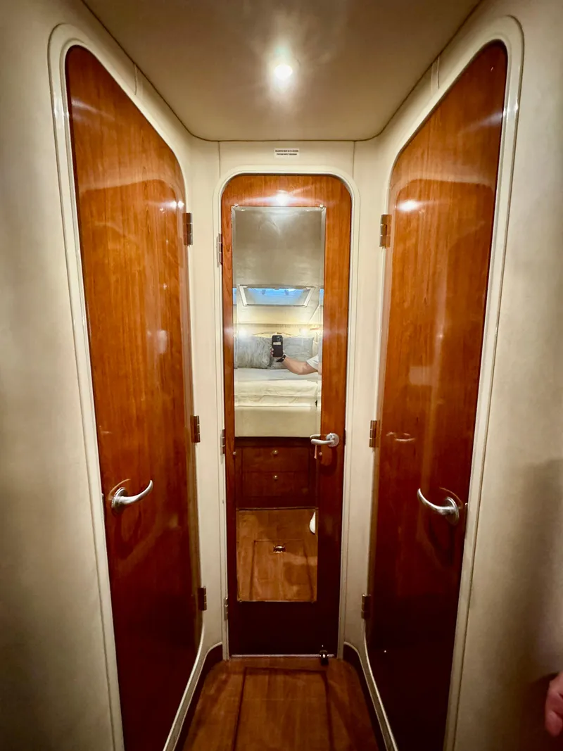 Slide: The Image of Interior hallway of 2004 Sea Ray 420 Sundancer yacht with wooden doors and mirror. - 20