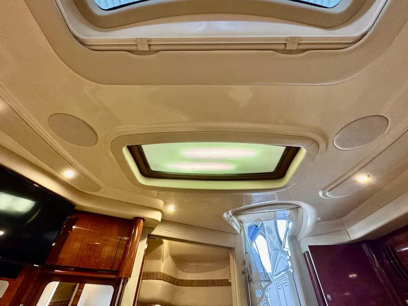 Slide: The Image of Interior view of 2004 Sea Ray 420 Sundancer yacht with skylight and modern design. - 26