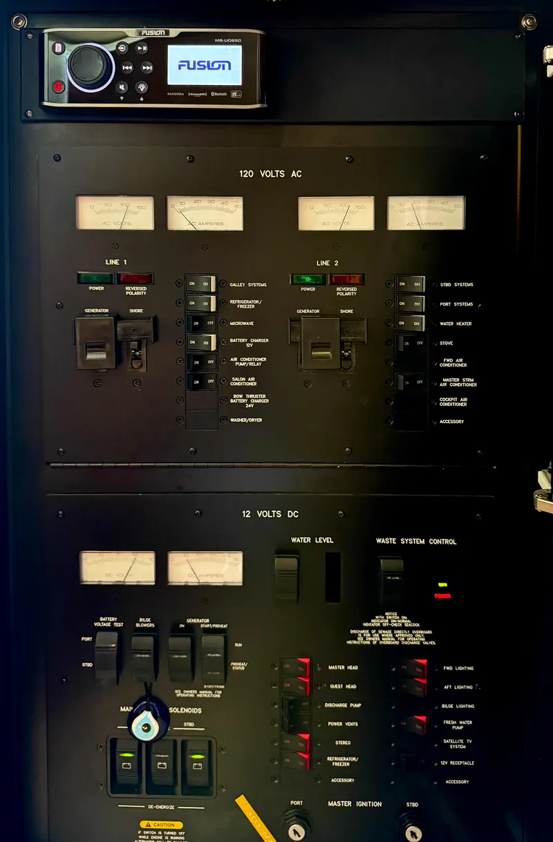 Slide: The Image of Electrical control panel of a 2004 Sea Ray 420 Sundancer boat. - 28