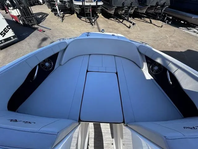 Slide: The Image of 2023 Sea Ray SPX 210 boat interior with white seating and speakers. - 9