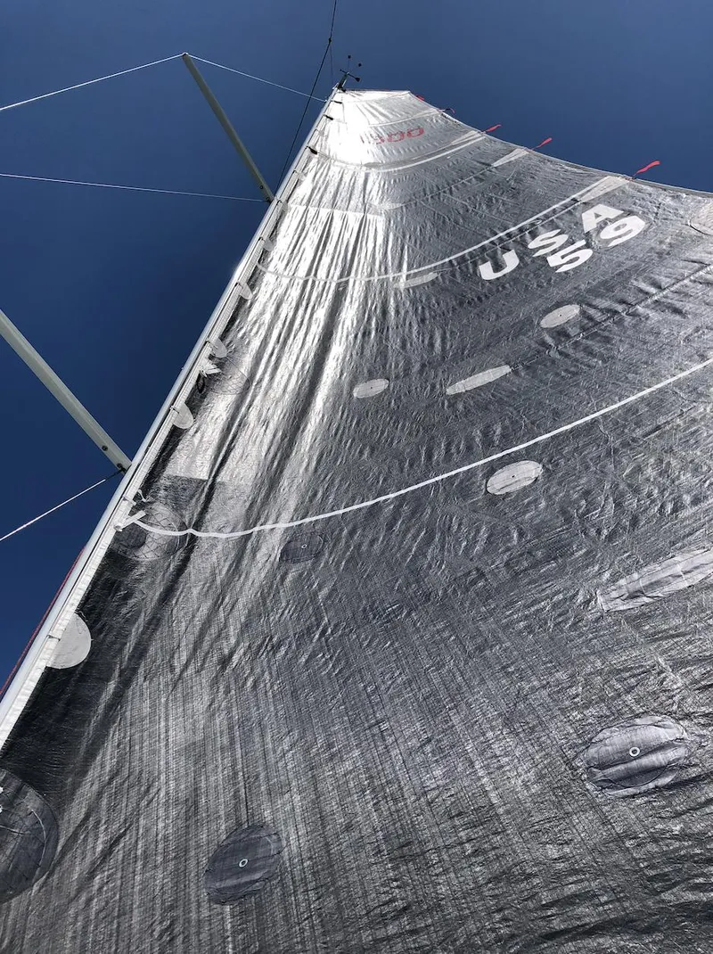 Slide: The Image of Sail of 2021 Jeanneau SUNFAST 3300 against clear blue sky. - 16