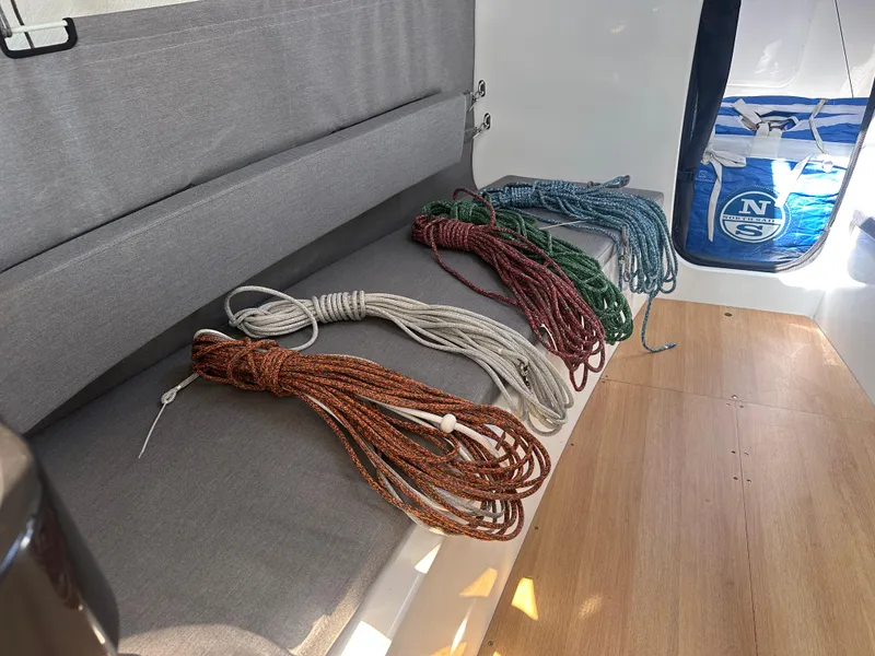 Slide: The Image of Coiled ropes on Jeanneau Sun Fast 3300 sailboat interior, 2021 model. - 17