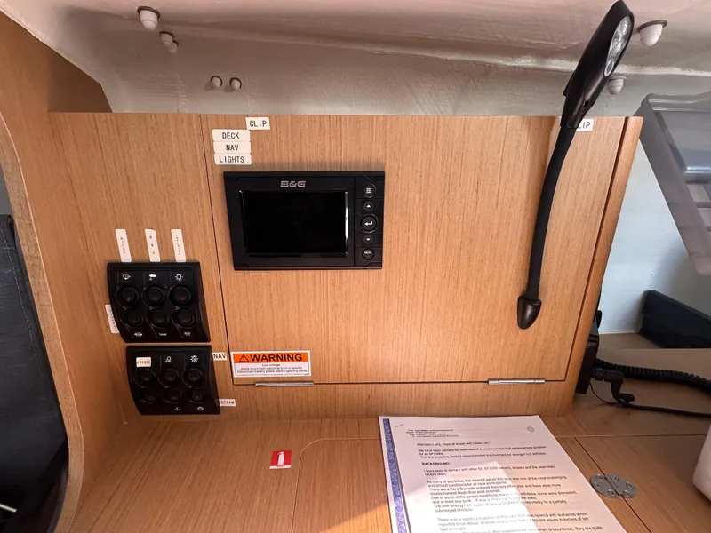 Slide: The Image of Control panel inside 2021 Jeanneau Sun Fast 3300 sailboat, featuring navigation and electrical switches. - 19