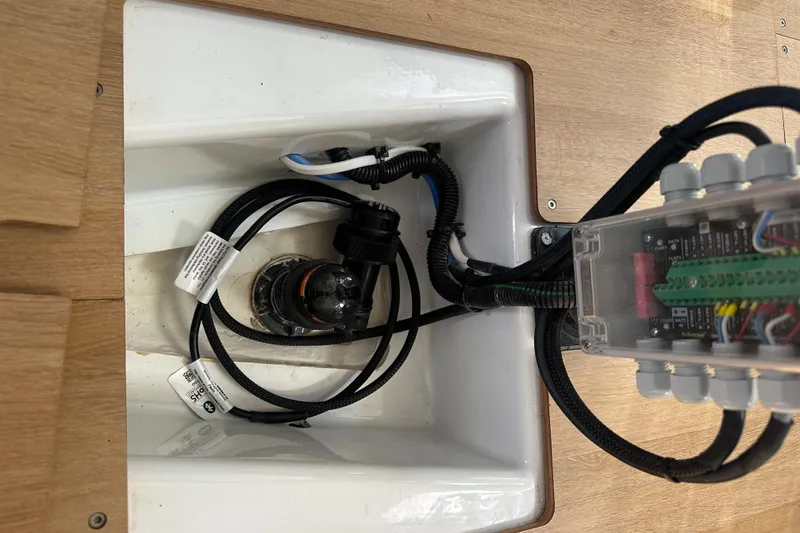 Slide: The Image of Electrical wiring and components inside a 2021 Jeanneau Sun Fast 3300 yacht. - 26