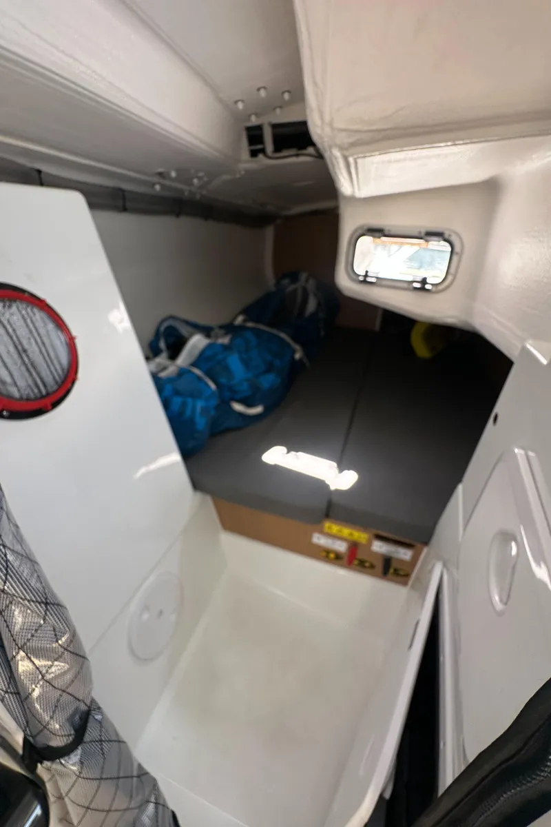 Slide: The Image of Interior of 2021 Jeanneau Sun Fast 3300 sailboat, featuring compact sleeping quarters. - 29