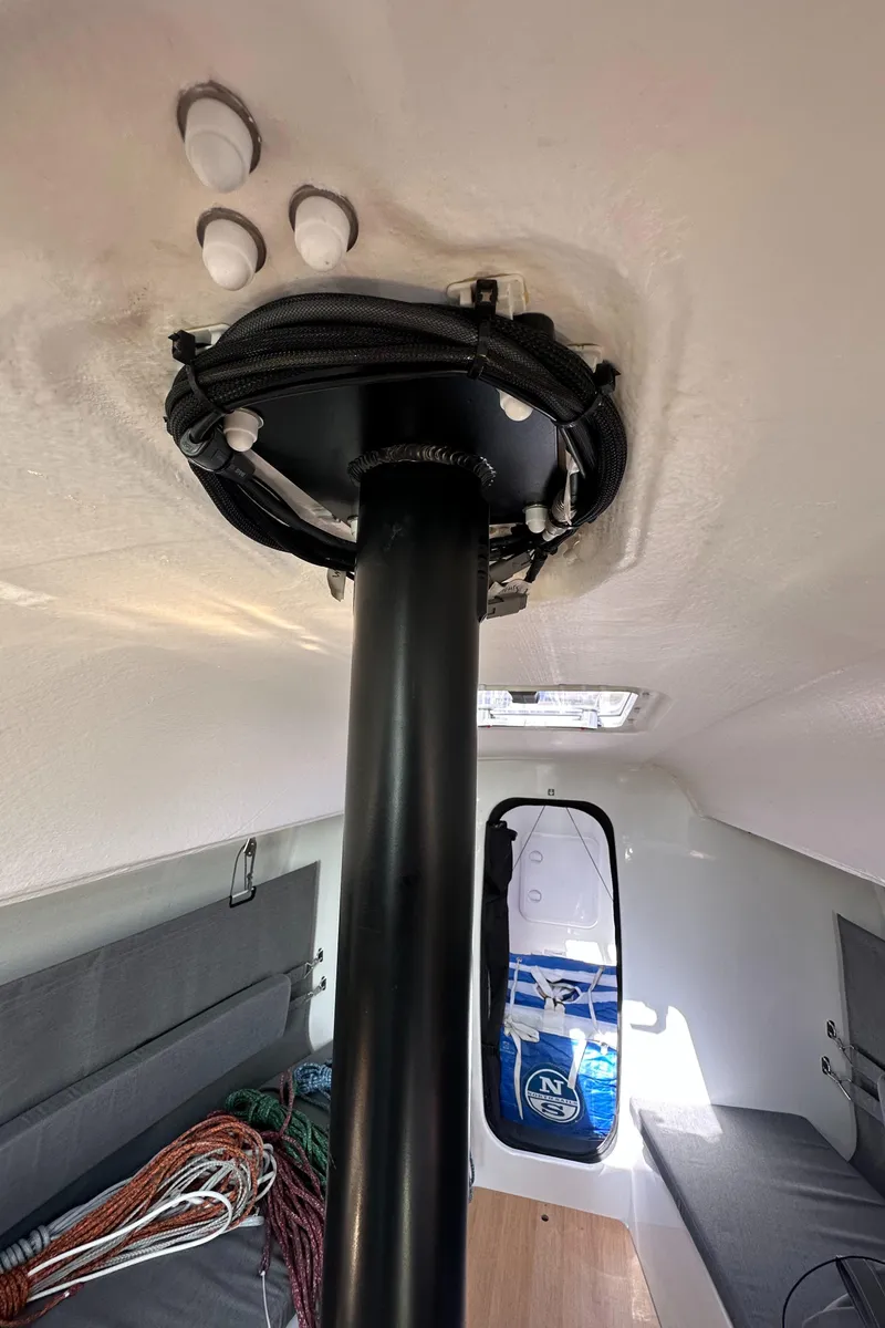 Slide: The Image of Interior view of 2021 Jeanneau Sun Fast 3300 sailboat, showing mast and cabin details. - 37