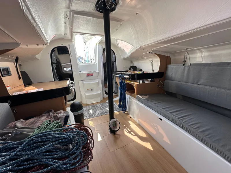 Slide: The Image of Interior of 2021 Jeanneau Sun Fast 3300 sailboat with seating and ropes. - 41