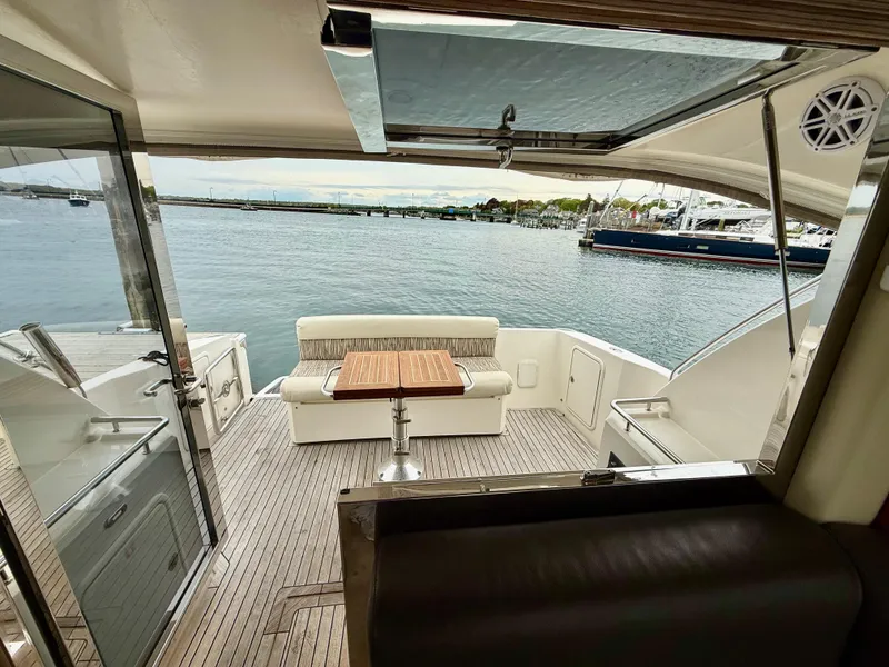 Slide: The Image of 2007 Riviera 3600 Sport Yacht interior with seating area and ocean view. - 10
