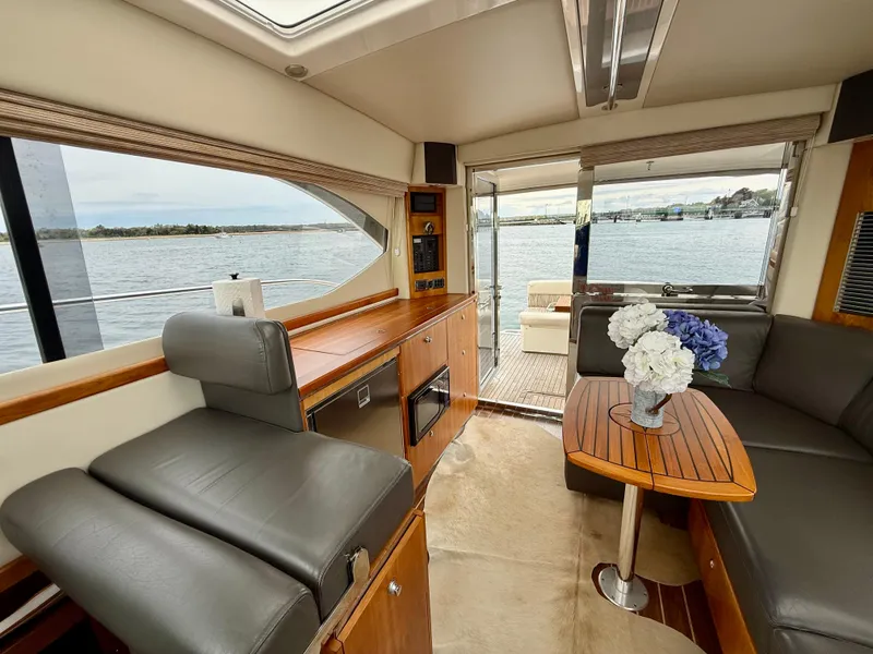 Slide: The Image of Interior of 2007 Riviera 3600 Sport Yacht with elegant seating and water view. - 15