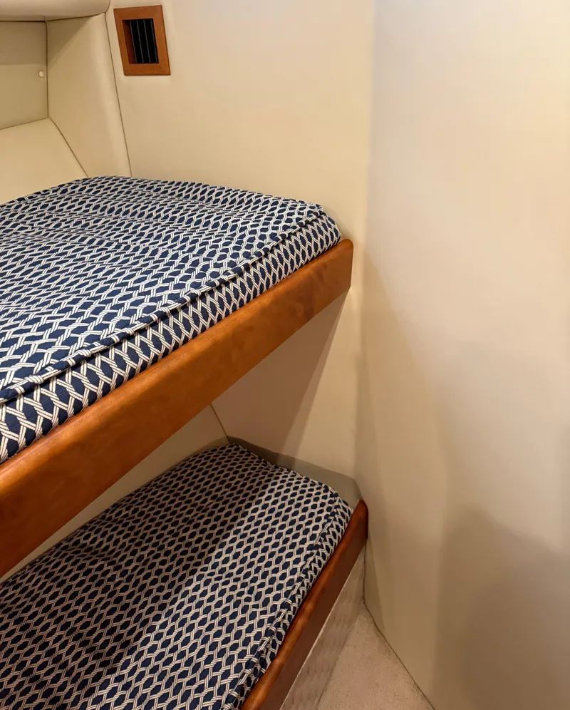 Slide: The Image of Bunk beds with patterned cushions in 2007 Riviera 3600 Sport Yacht interior. - 22