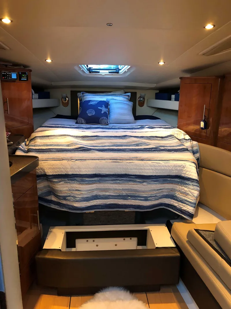 Slide: The Image of Interior of 2012 Regal 35 Sport Coupe with cozy bed and modern lighting. - 8