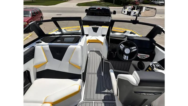 Slide: The Image of 2023 Nautique Super Air Nautique S21 interior with modern design and sleek dashboard. - 12