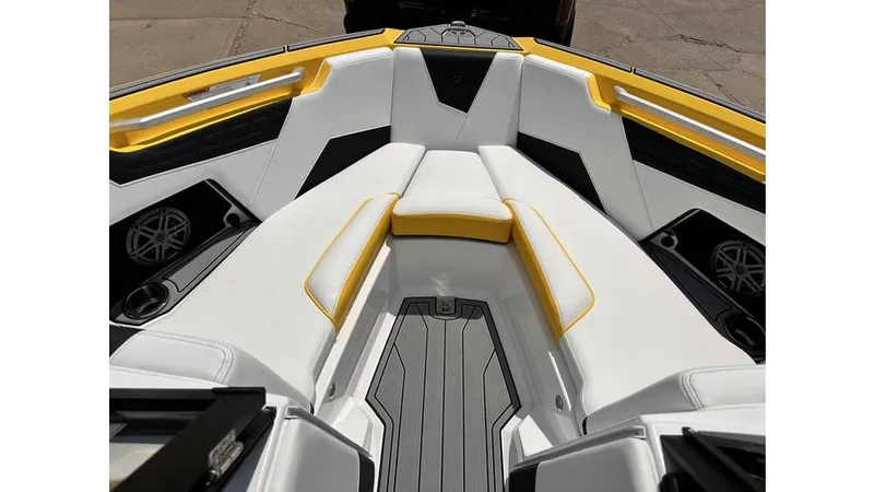 Slide: The Image of 2023 Nautique Super Air Nautique S21 interior with white and yellow seating. - 13