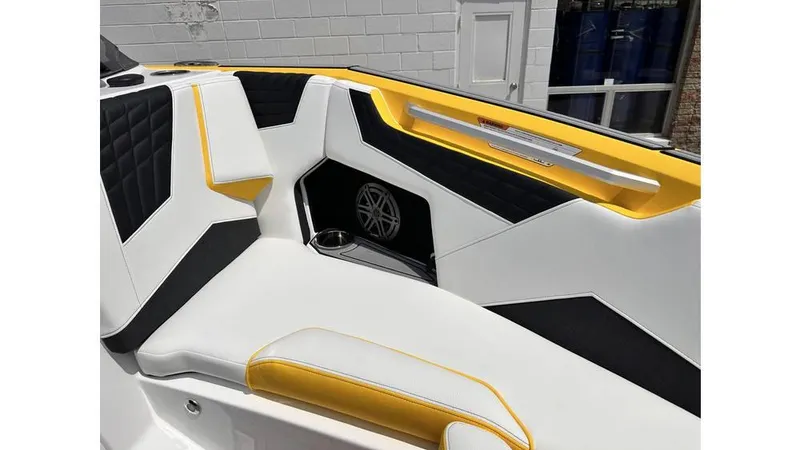 Slide: The Image of 2023 Nautique Super Air Nautique S21 interior with yellow, black, and white seating. - 15