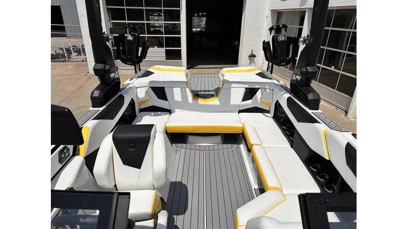Slide: The Image of 2023 Nautique Super Air Nautique S21 interior with white and yellow seating. - 16