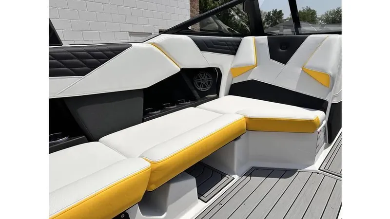 Slide: The Image of 2023 Nautique Super Air Nautique S21 interior with white and yellow seating. - 19