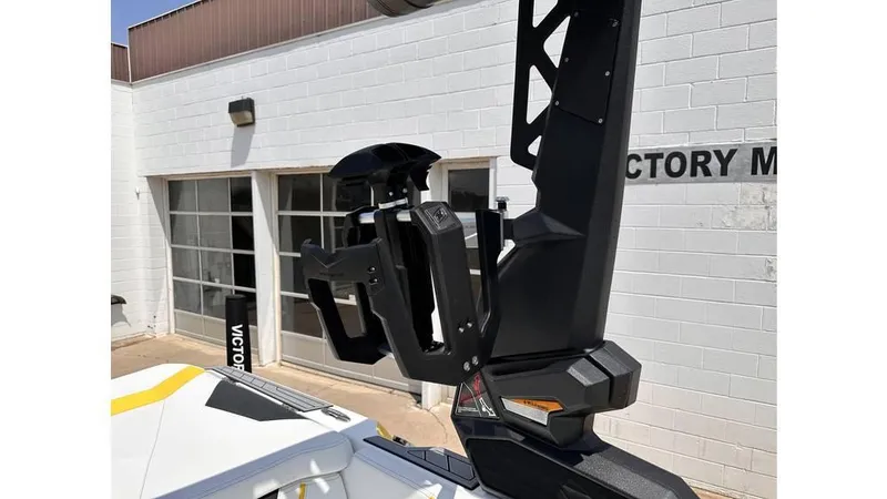 Slide: The Image of 2023 Nautique Super Air Nautique S21 boat tower detail in a sunny outdoor setting. - 23