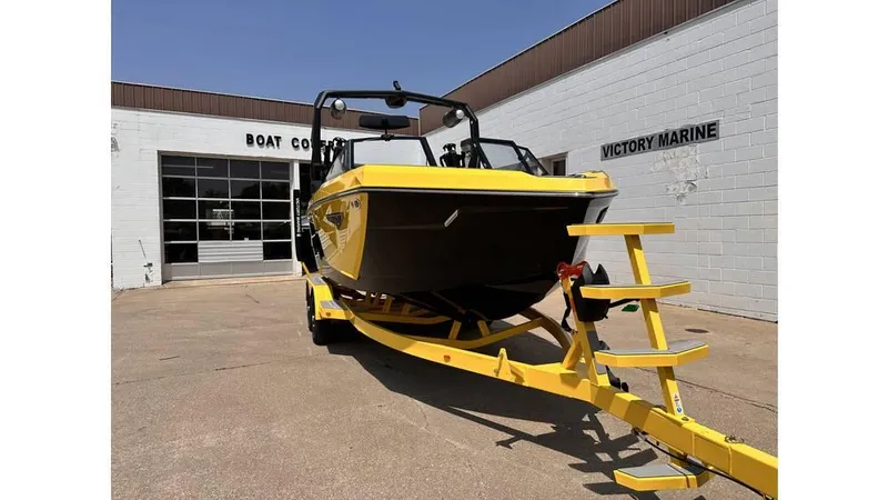 Slide: The Image of 2023 Nautique Super Air Nautique S21 boat on yellow trailer at Victory Marine. - 4
