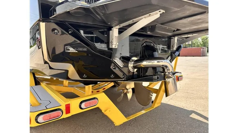 Slide: The Image of 2023 Nautique Super Air Nautique S21 boat stern on yellow trailer. - 9