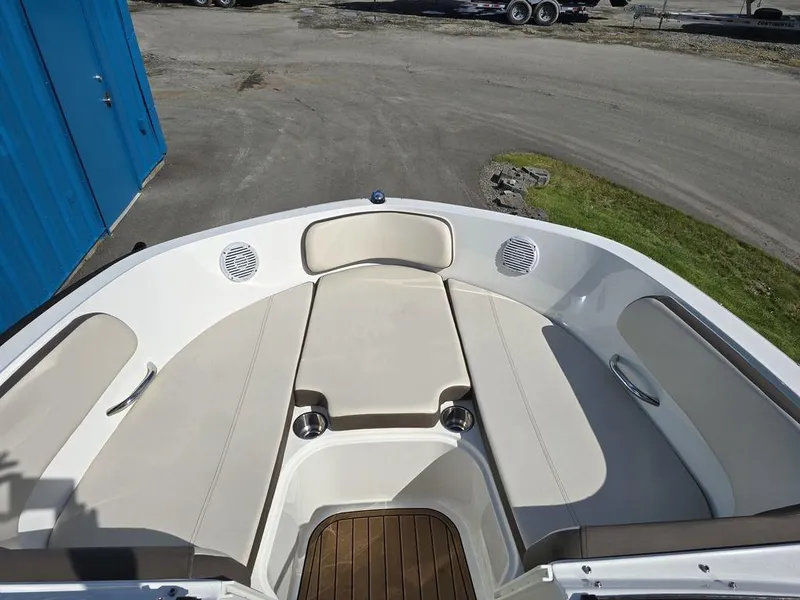 Slide: The Image of 2019 Bayliner VR5 Bowrider OB interior with beige seating and cup holders. - 4