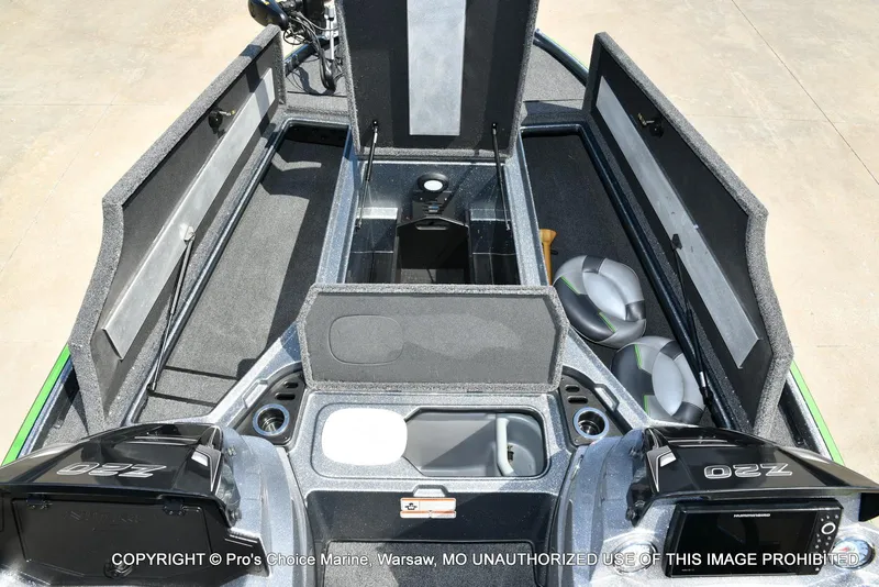 Slide: The Image of 2021 Nitro Z20 Pro Pack boat interior with open storage compartments and seating. - 11