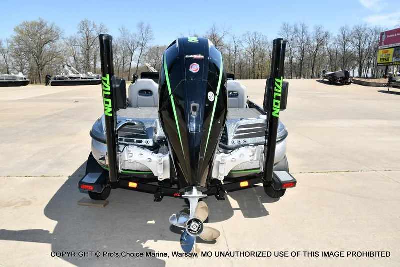 Slide: The Image of 2021 Nitro Z20 Pro Pack boat with Talon anchors, rear view in a parking lot. - 12