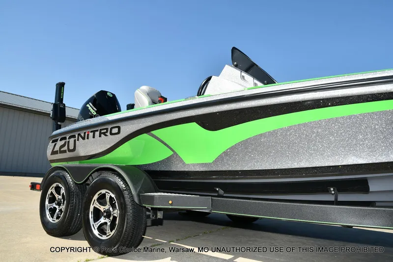 Slide: The Image of 2021 Nitro Z20 Pro Pack boat with vibrant green accents on a trailer. - 16