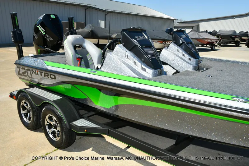 Slide: The Image of 2021 Nitro Z20 Pro Pack boat with dual seats and vibrant green accents. - 2