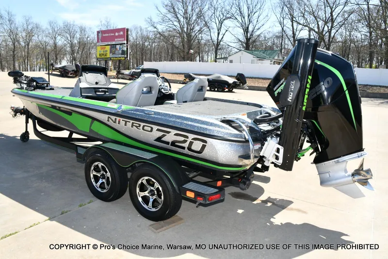 Slide: The Image of 2021 Nitro Z20 Pro Pack boat with sleek design and powerful engine, parked outdoors. - 26