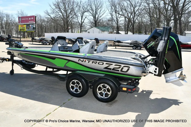 Slide: The Image of 2021 Nitro Z20 Pro Pack boat with sleek design and powerful engine, parked outdoors. - 27