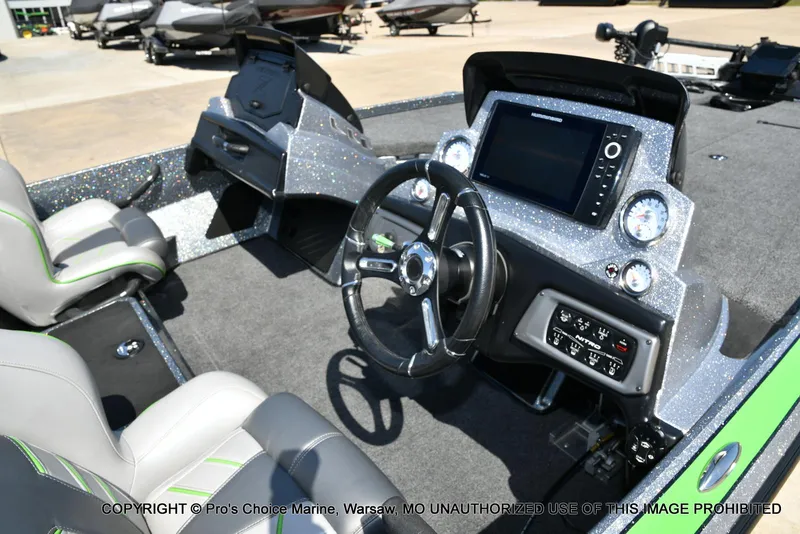 Slide: The Image of 2021 Nitro Z20 Pro Pack boat interior with steering wheel and dashboard controls. - 39
