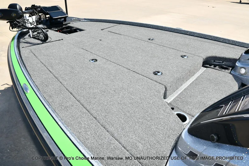 Slide: The Image of 2021 Nitro Z20 Pro Pack boat deck with carpeted surface and fishing equipment. - 42