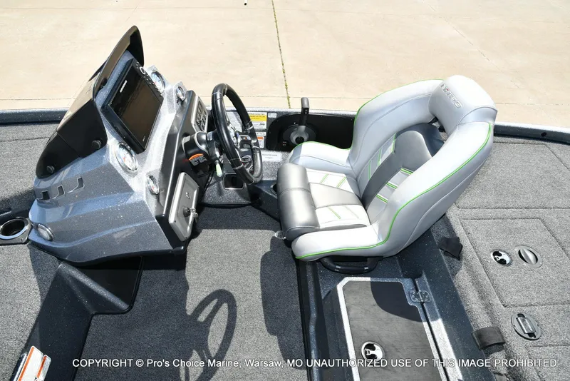 Slide: The Image of Nitro Z20 Pro Pack 2021 boat interior with steering console and cushioned seat. - 46
