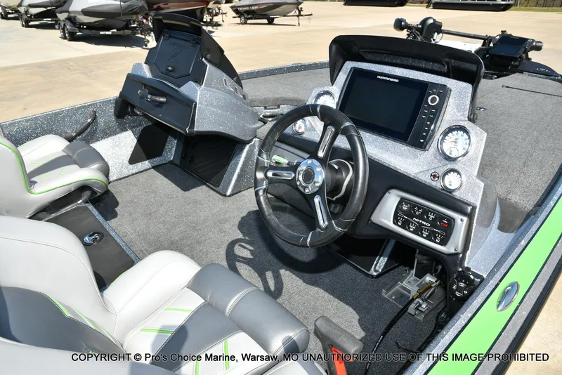 Slide: The Image of Interior of a 2021 Nitro Z20 Pro Pack boat with steering wheel and dashboard controls. - 6