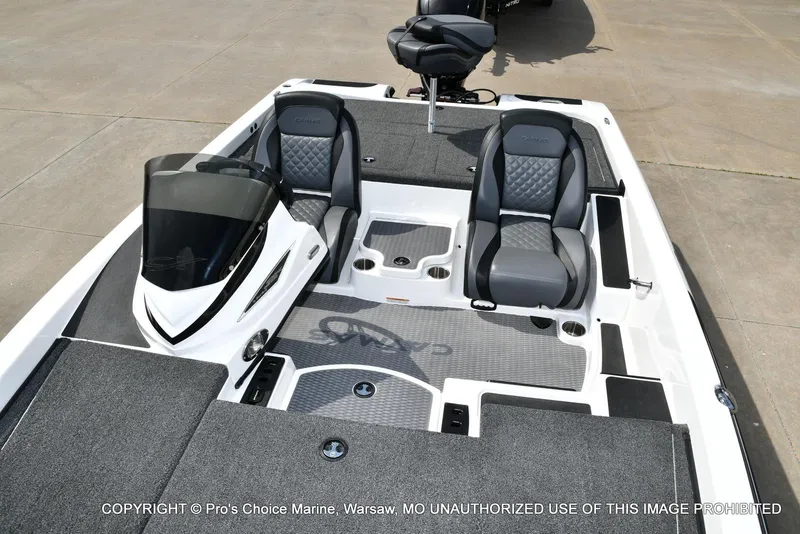 Slide: The Image of 2023 Caymas CX 18 boat interior with dual seats and console, featuring a 150 Mercury Pro-XS engine. - 11