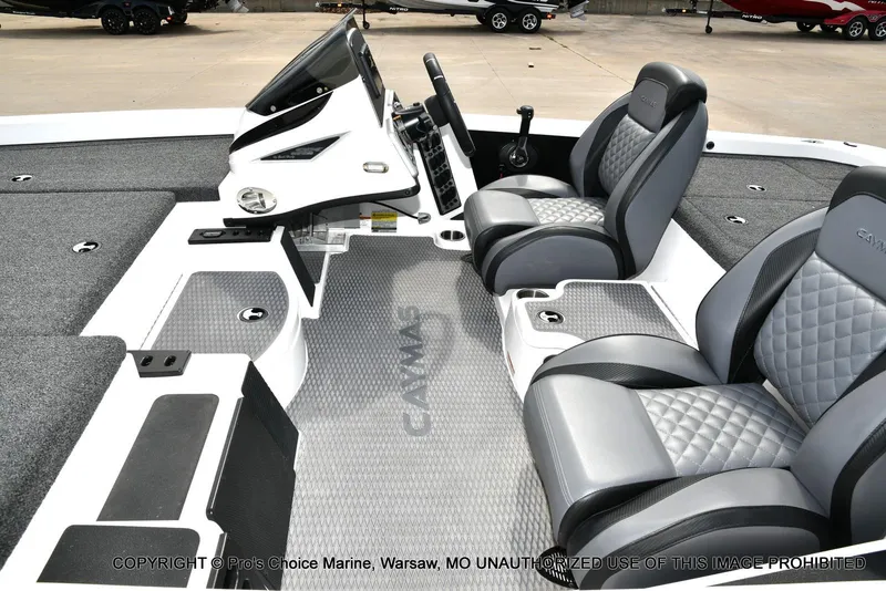 Slide: The Image of 2023 Caymas CX 18 boat interior with dual seats and modern dashboard design. - 13